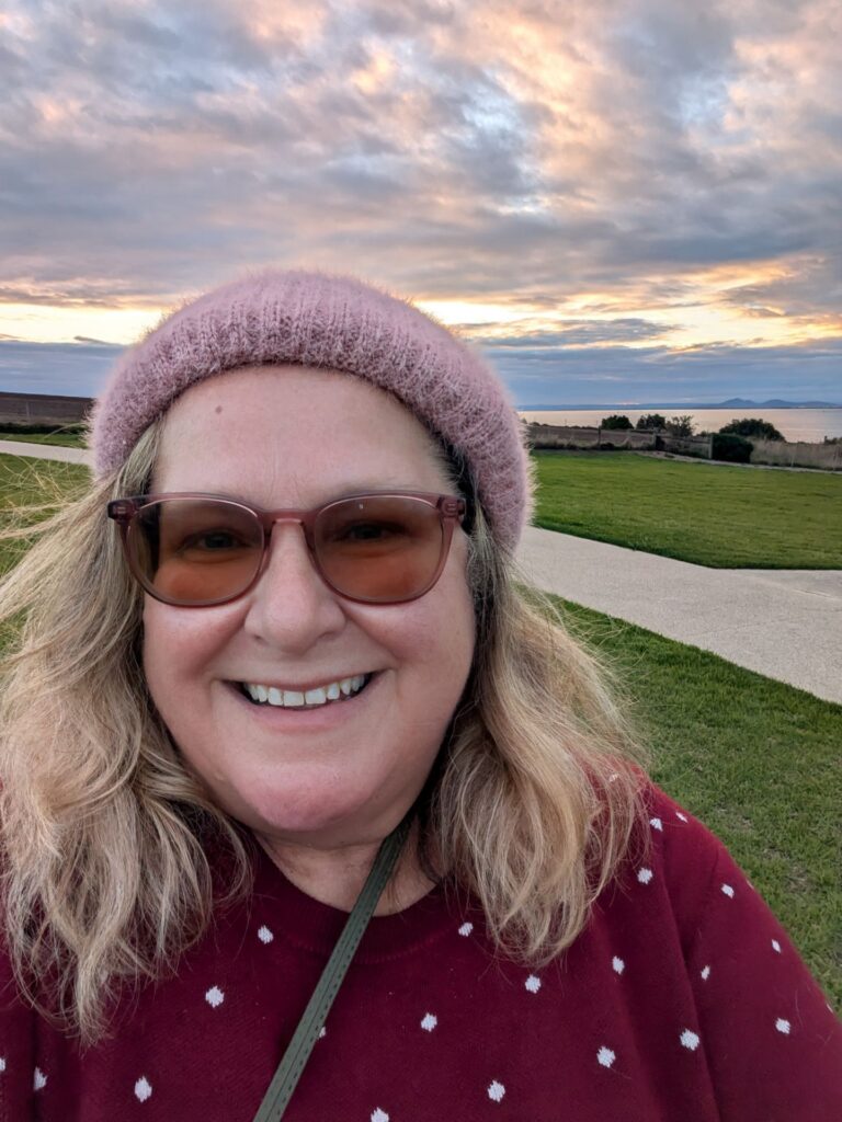 Nicki at sunset on a coastal path